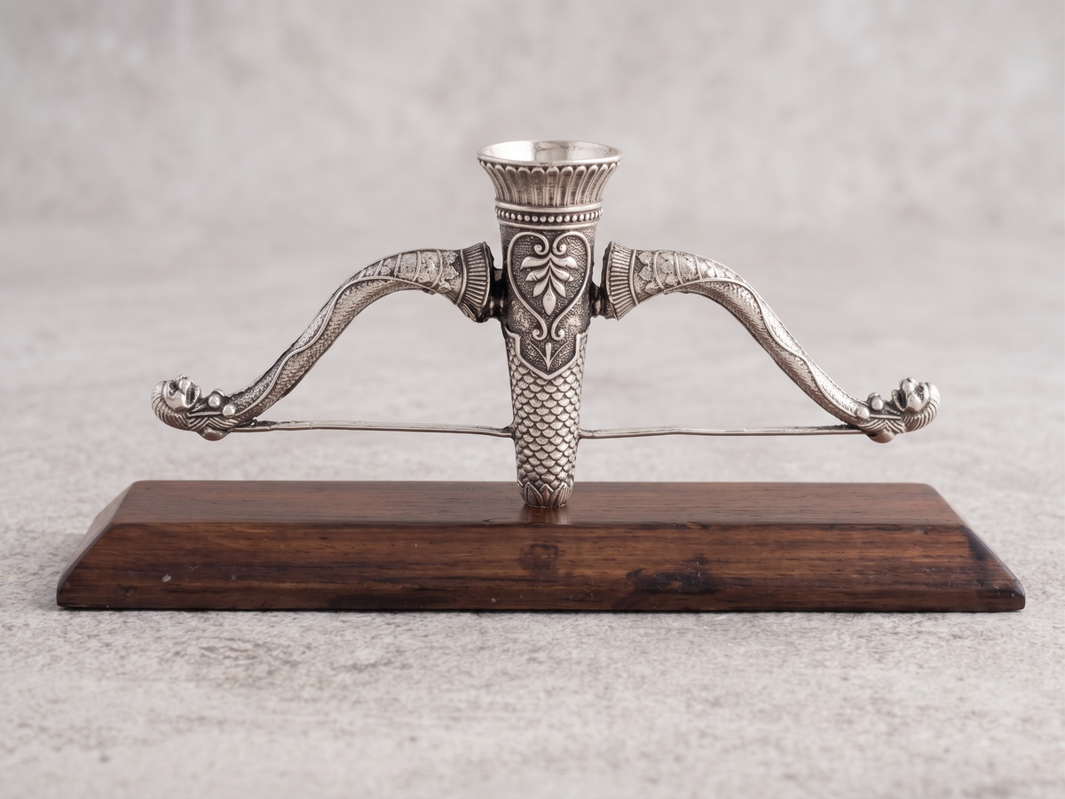 Ram Dhanush agarbatti stand in pure silver plating on a wooden stand
