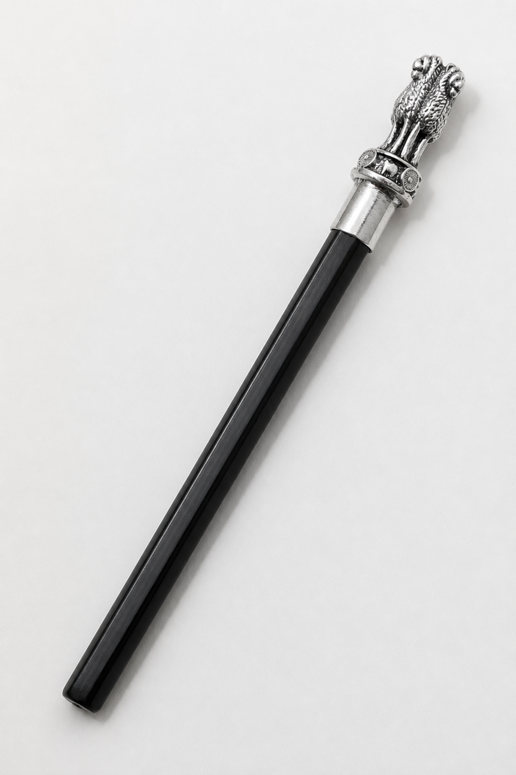 Ashoka Pillar silver-plated pencil topper fitted to a black pencil on an ivory background