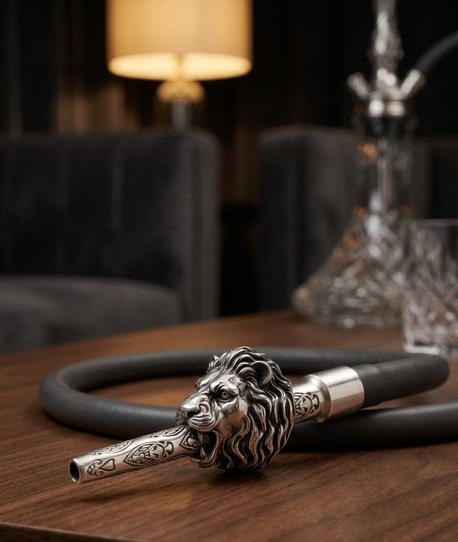 Sabera king lion hookah tip resting on a hookah hose on a wooden table