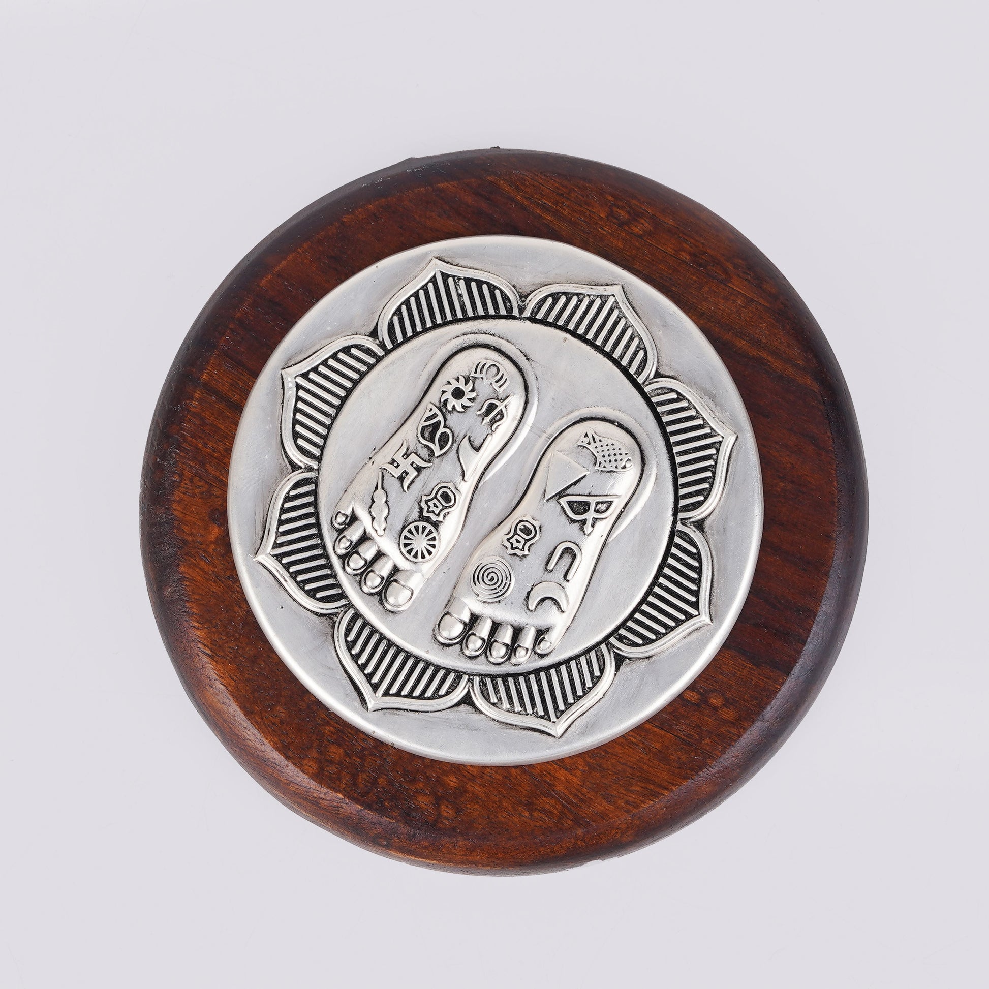 Lotus Lakshmi Charan silver charm on round wooden base