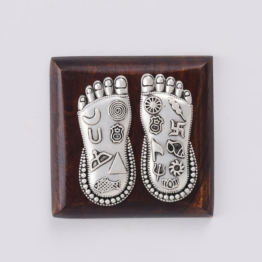 Lakshmi Charan foot silver charm on square wooden base