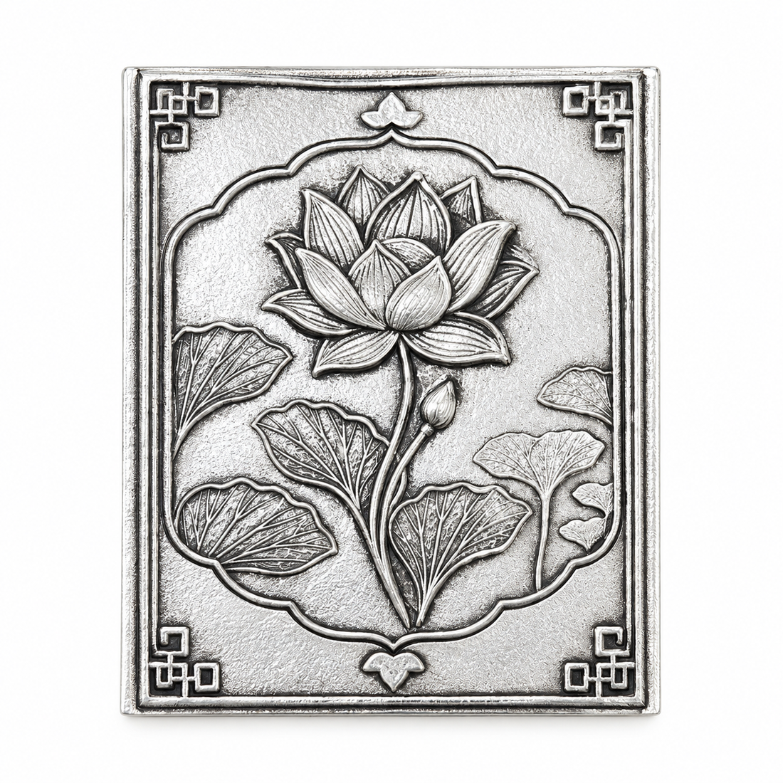 Silver-plated brass lotus matchbox cover standing upright, showing the hand-antiqued background