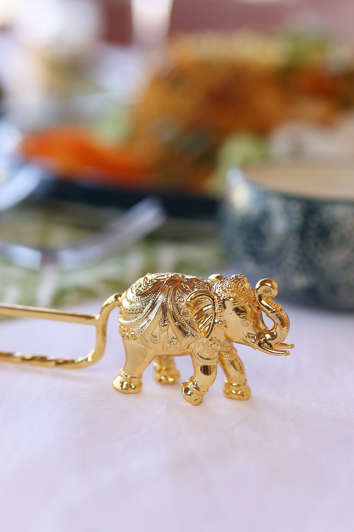 Elephant carved spoon rest in gold plating, one piece from the gift box