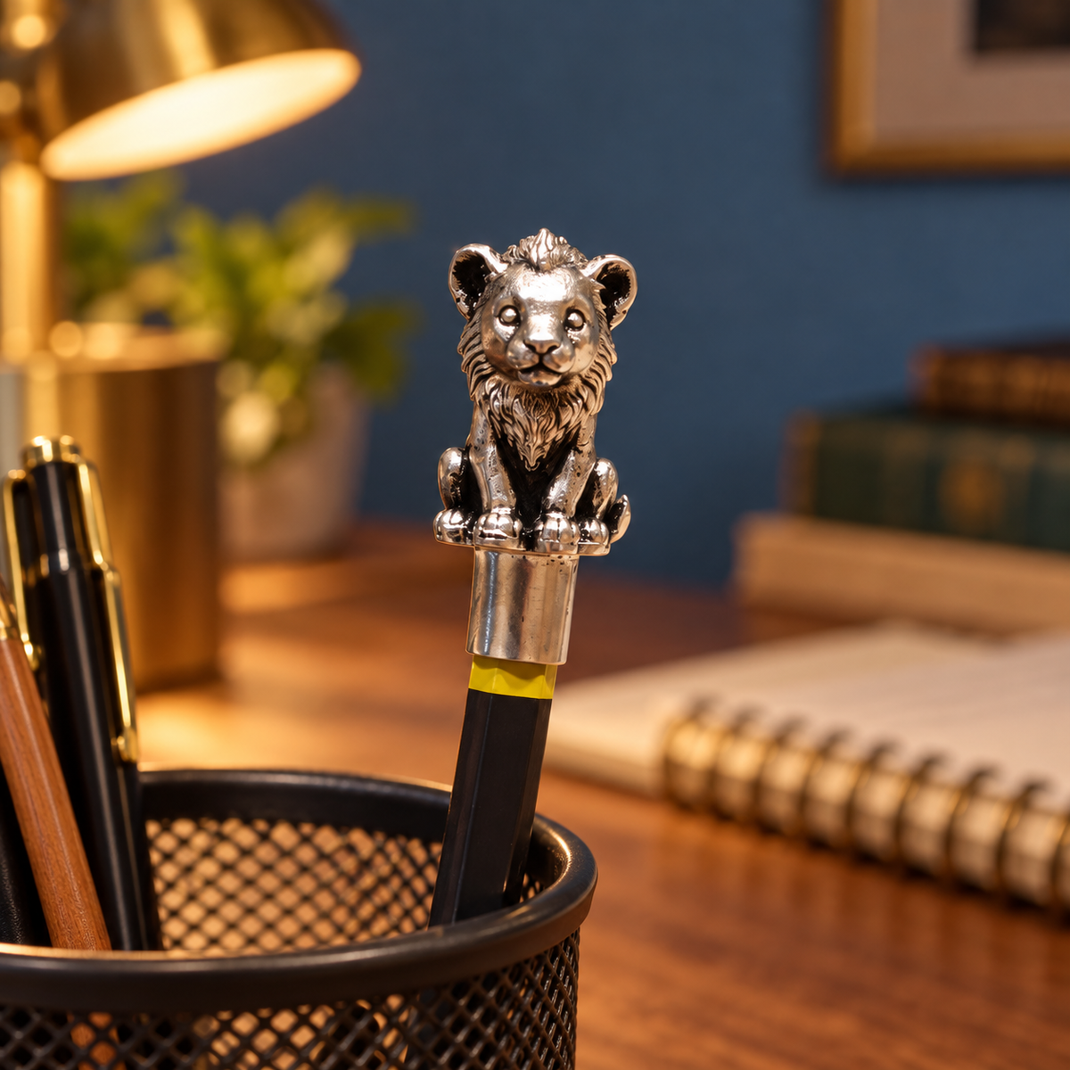Sheru lion cub pencil topper on a pencil standing in a desk pen holder