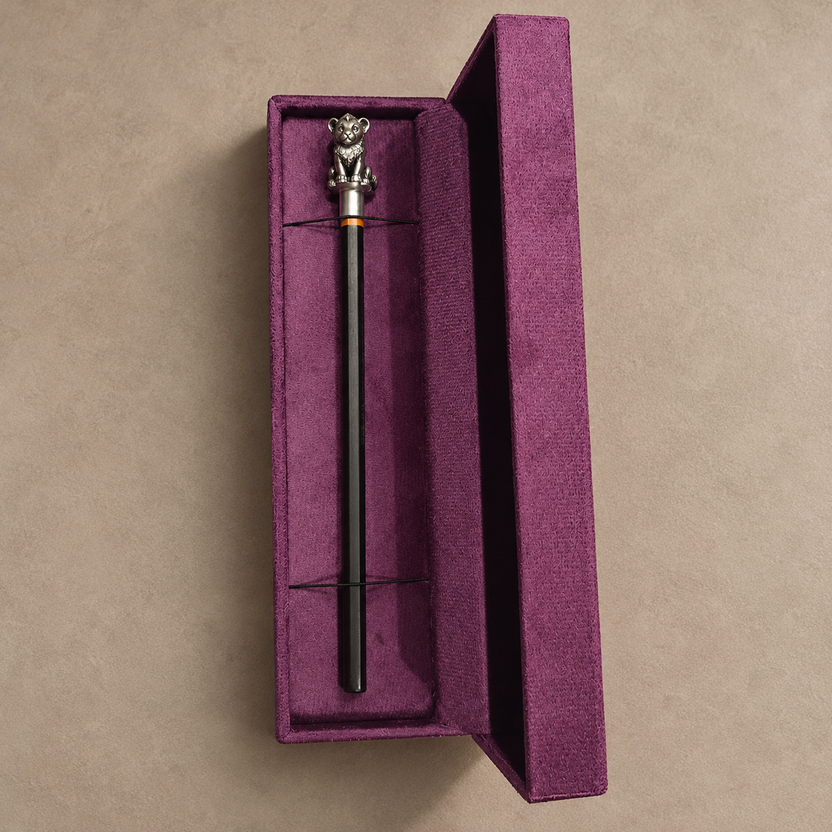 Sheru lion cub pencil topper on a pencil inside the SABERA velvet gift box
