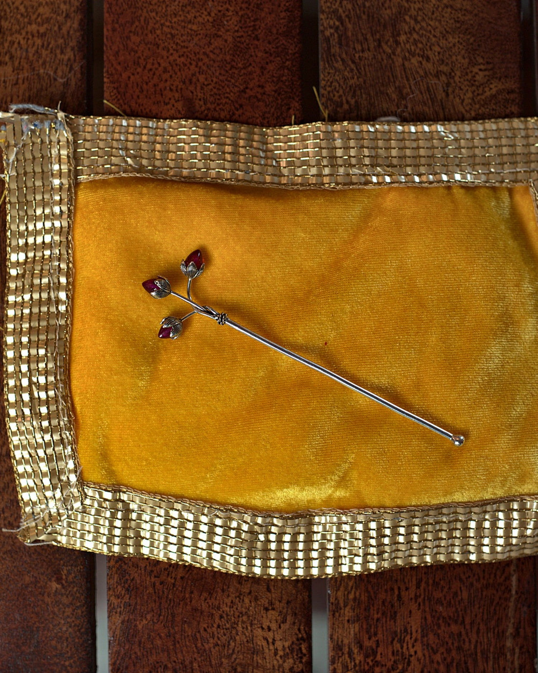 Trishakti silver-plated tilak stick with three ruby-coloured lotus buds