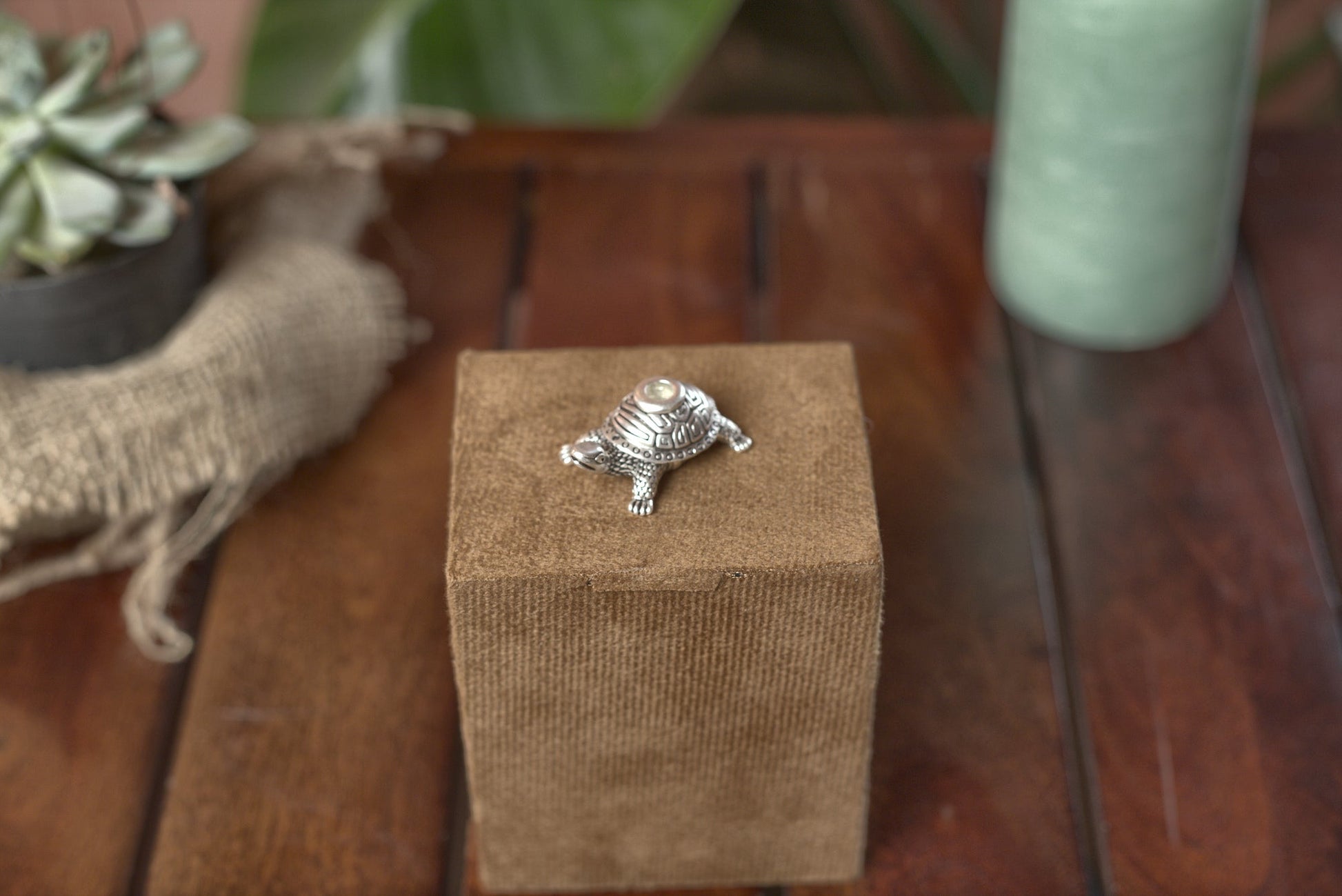 Top detail of the engraved pure silver-plated turtle dhoop stand