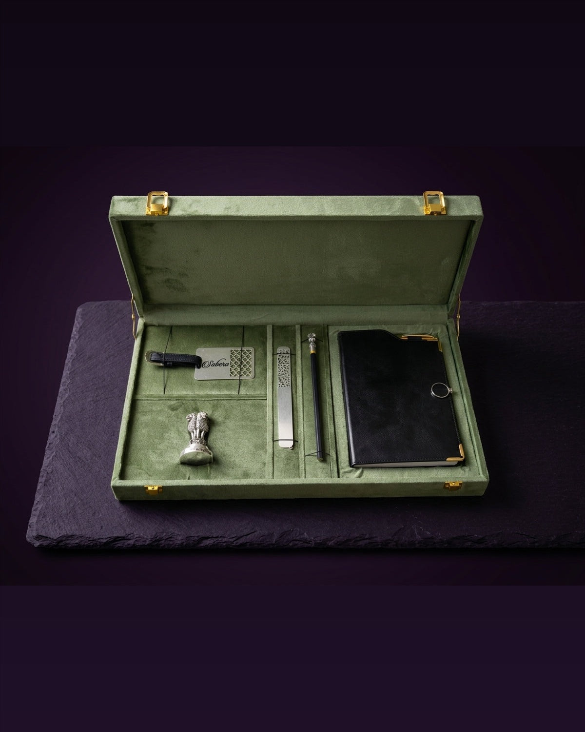 Open customized SABERA corporate gift box with engraved desk accessories and notebook