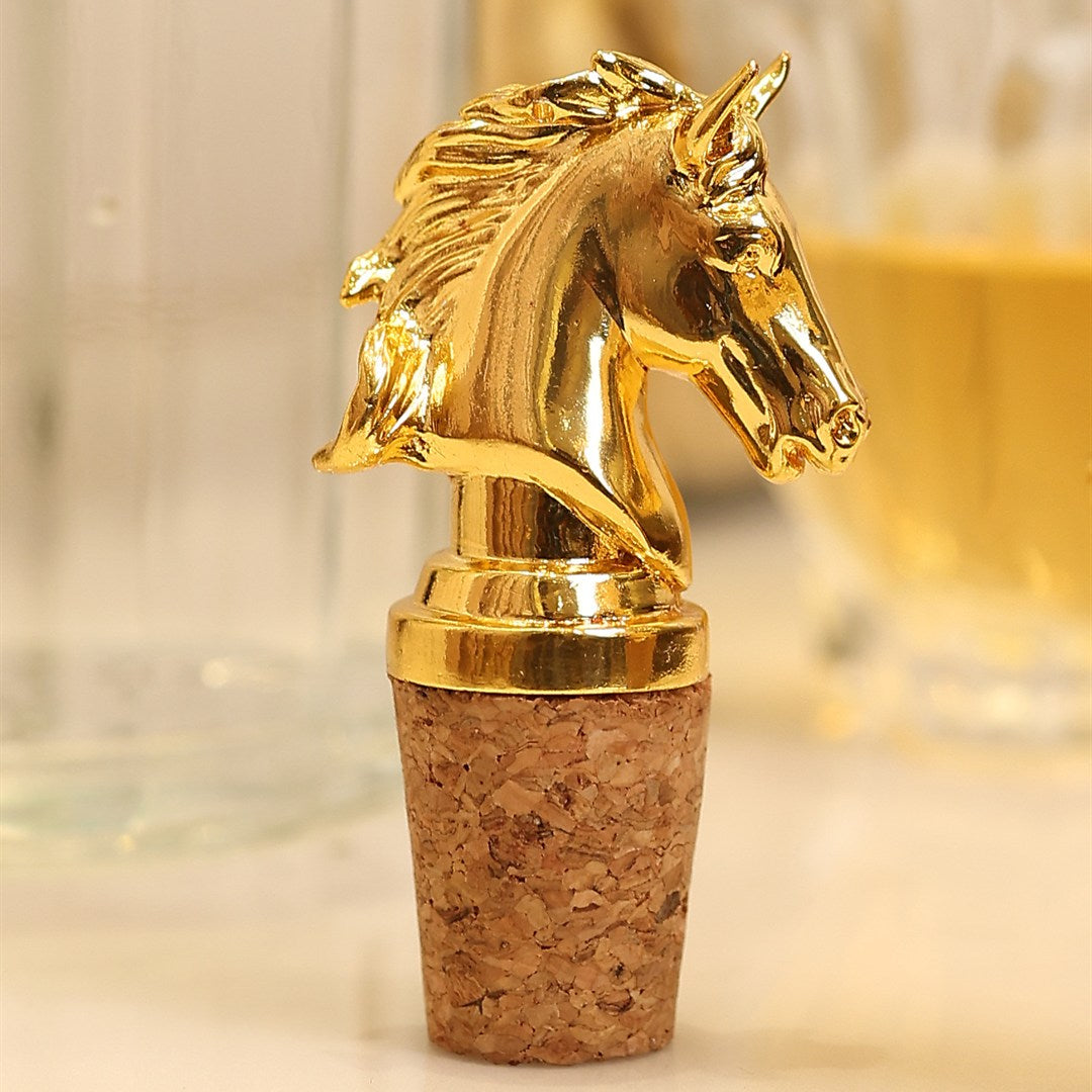 Silver horse-head bottle stopper displayed against a warm neutral backdrop.