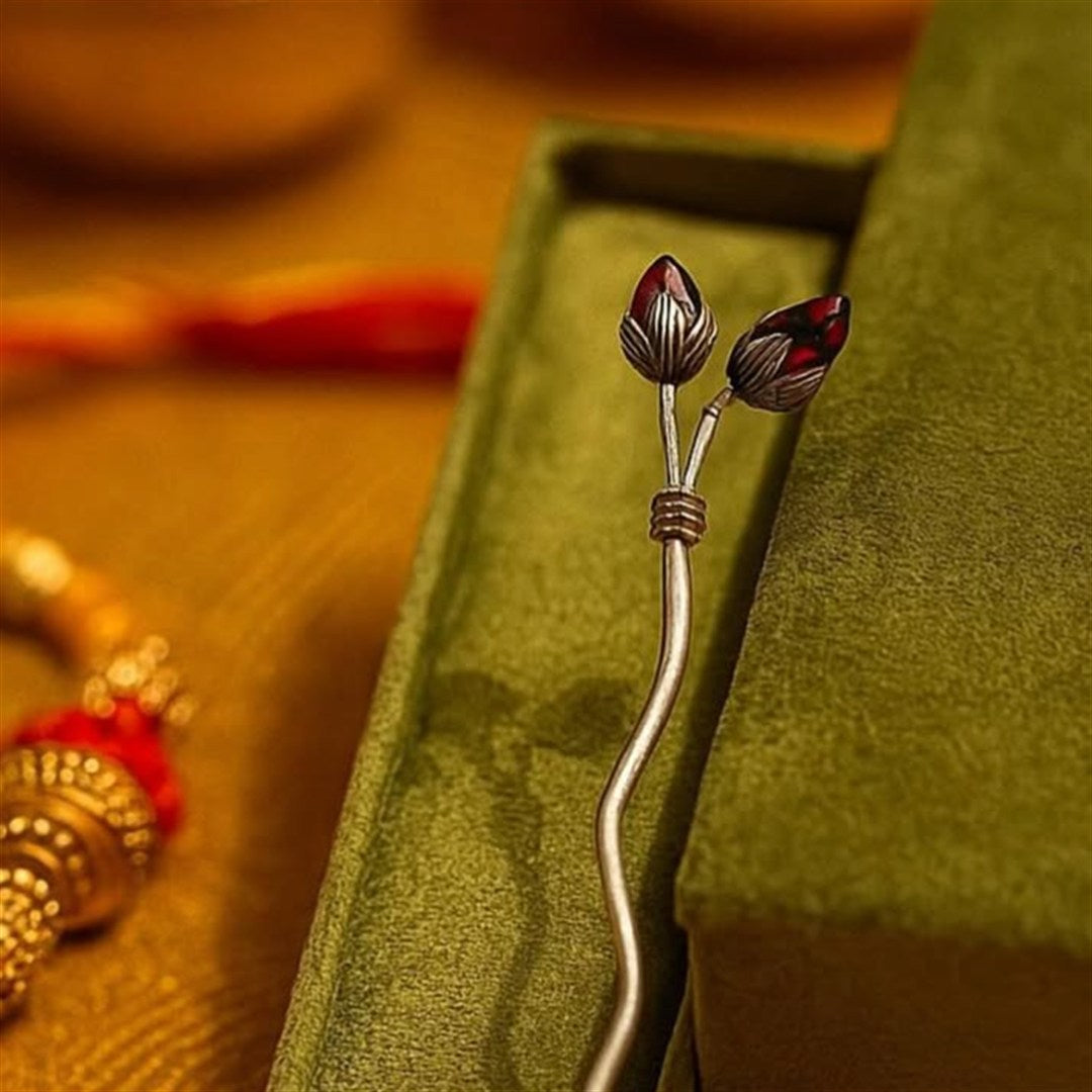 Detailed silver tilak motif presented on a decorative plate.